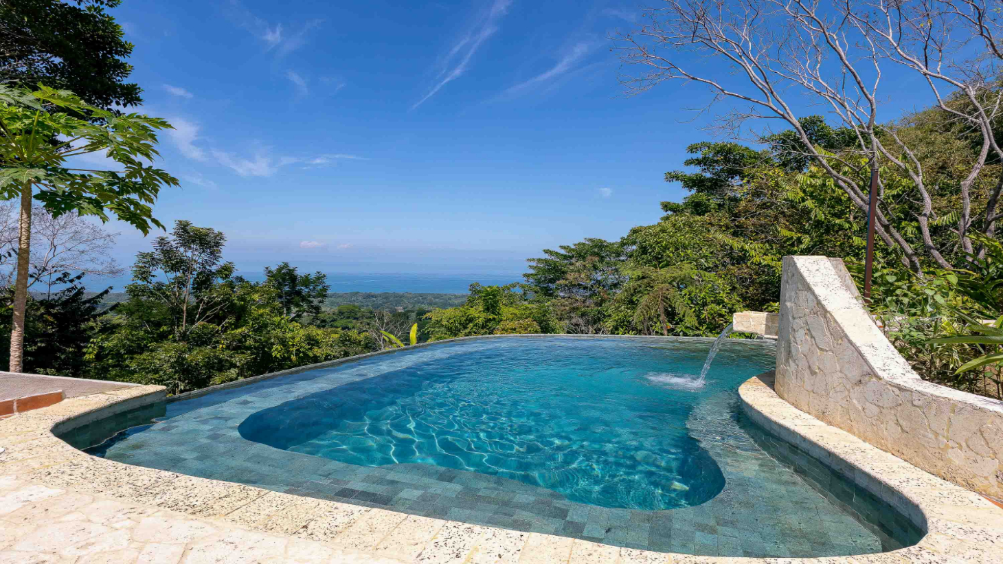 Infinity-edge pool on the ridge with an open view to the Pacific